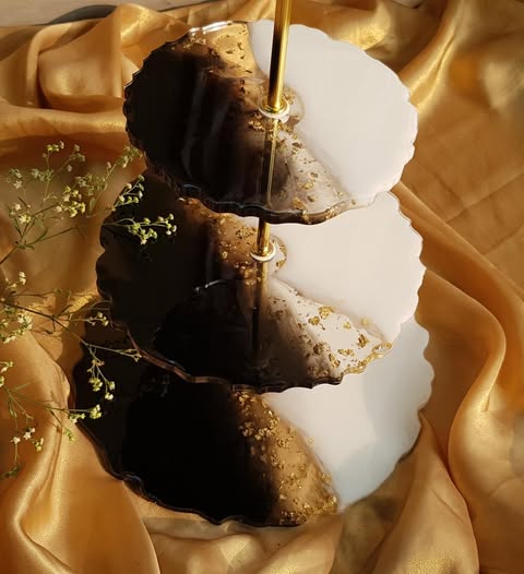 Three-tiered Dessert Stand with gold accents on a gold fabric background
