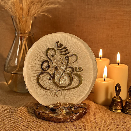 Ganesha home decor piece in a sacred space with bells and candles