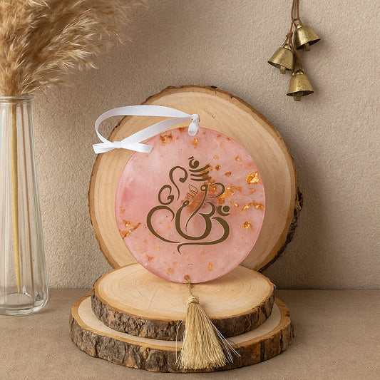 A ganesha keepsake in a minimal background with florals and bells