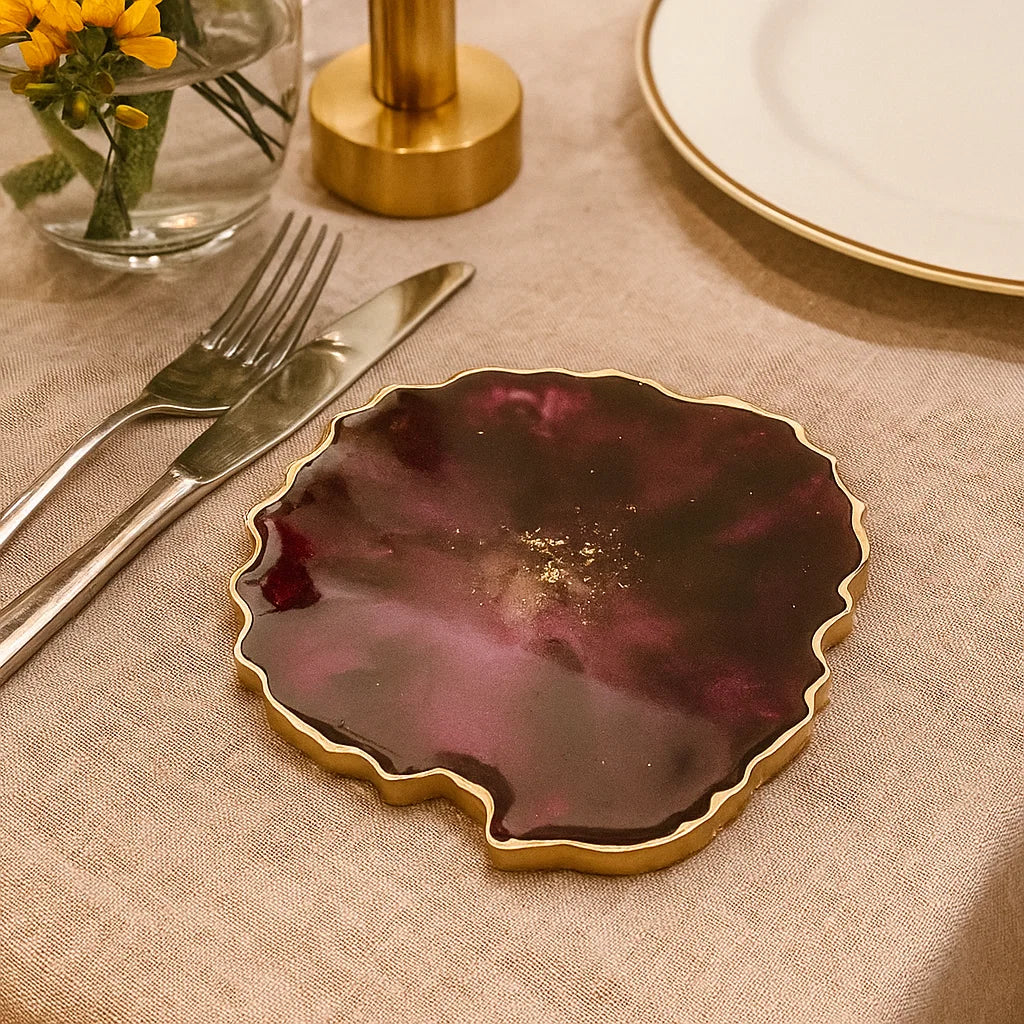 Deep Red Resin Coasters with gold edges in dining table setting