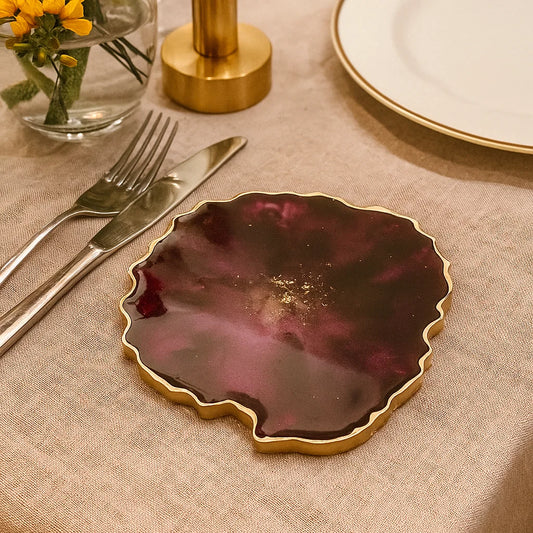 Deep Red Resin Coasters with gold edges in dining table setting