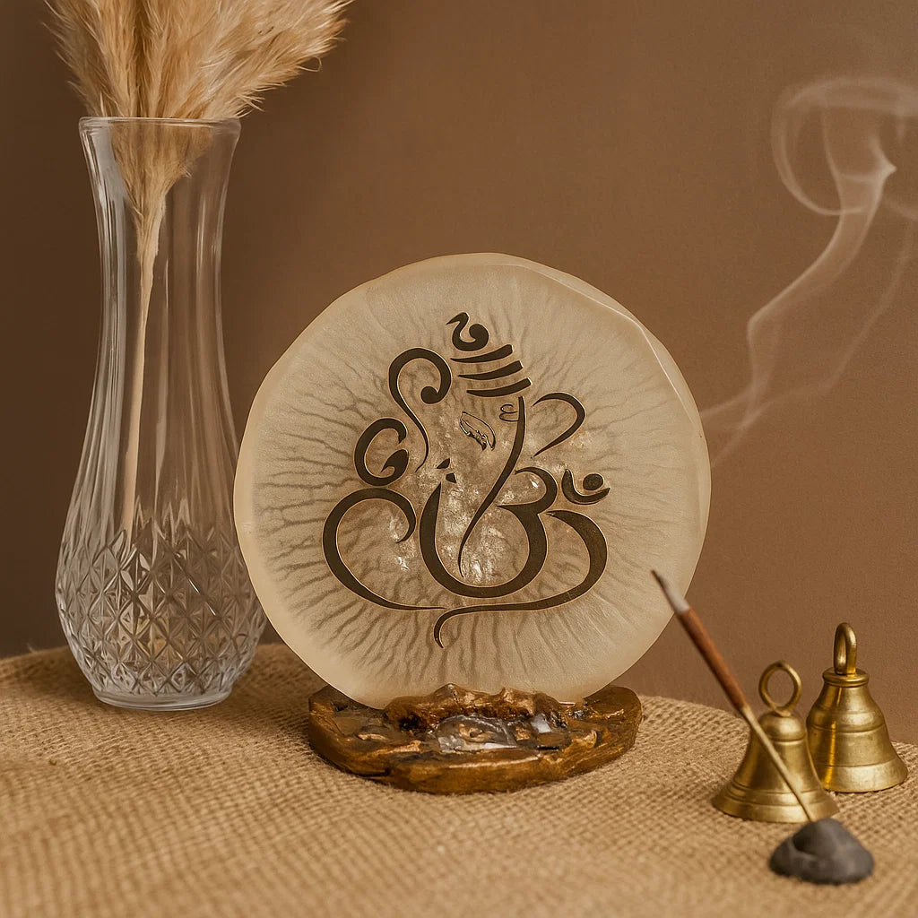 Ganesha home decor piece in a sacred space with bells and an incense stick