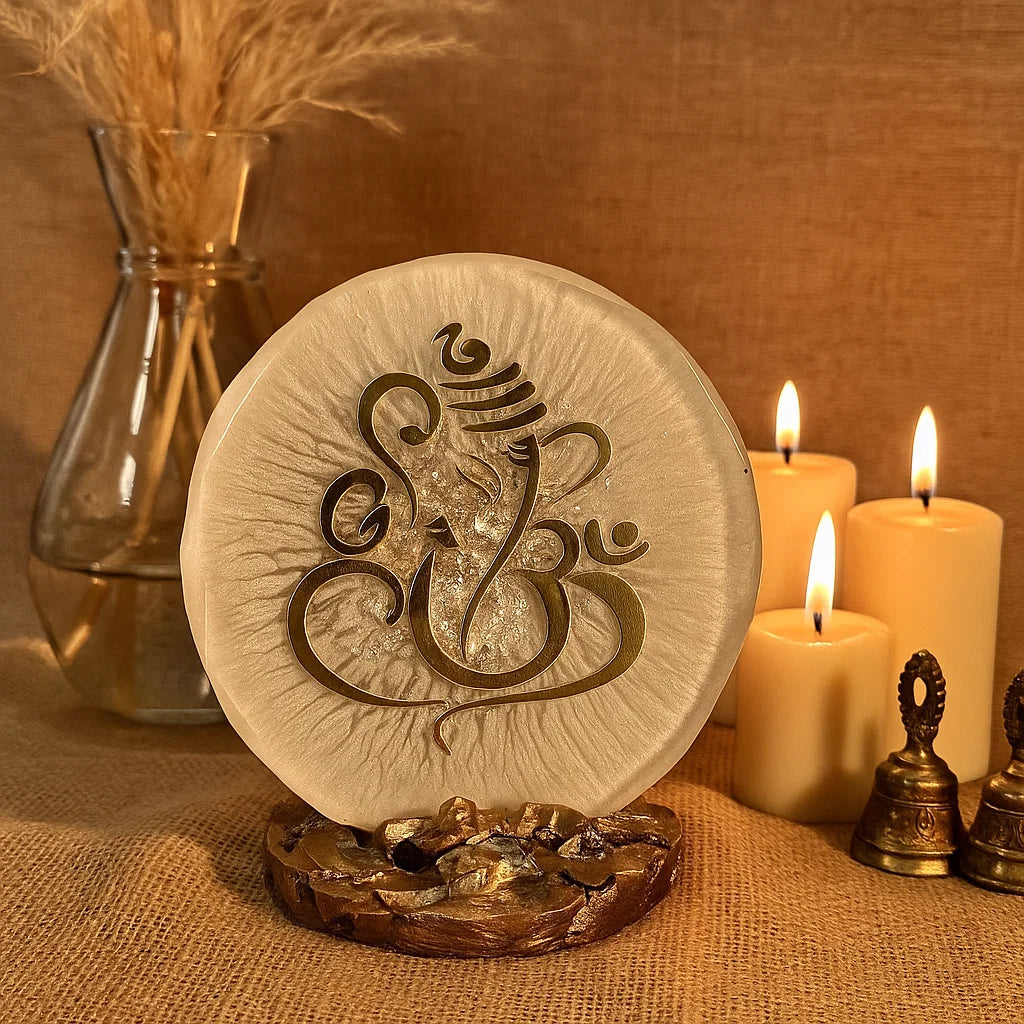 Ganesha home decor piece in a sacred space with bells and candles