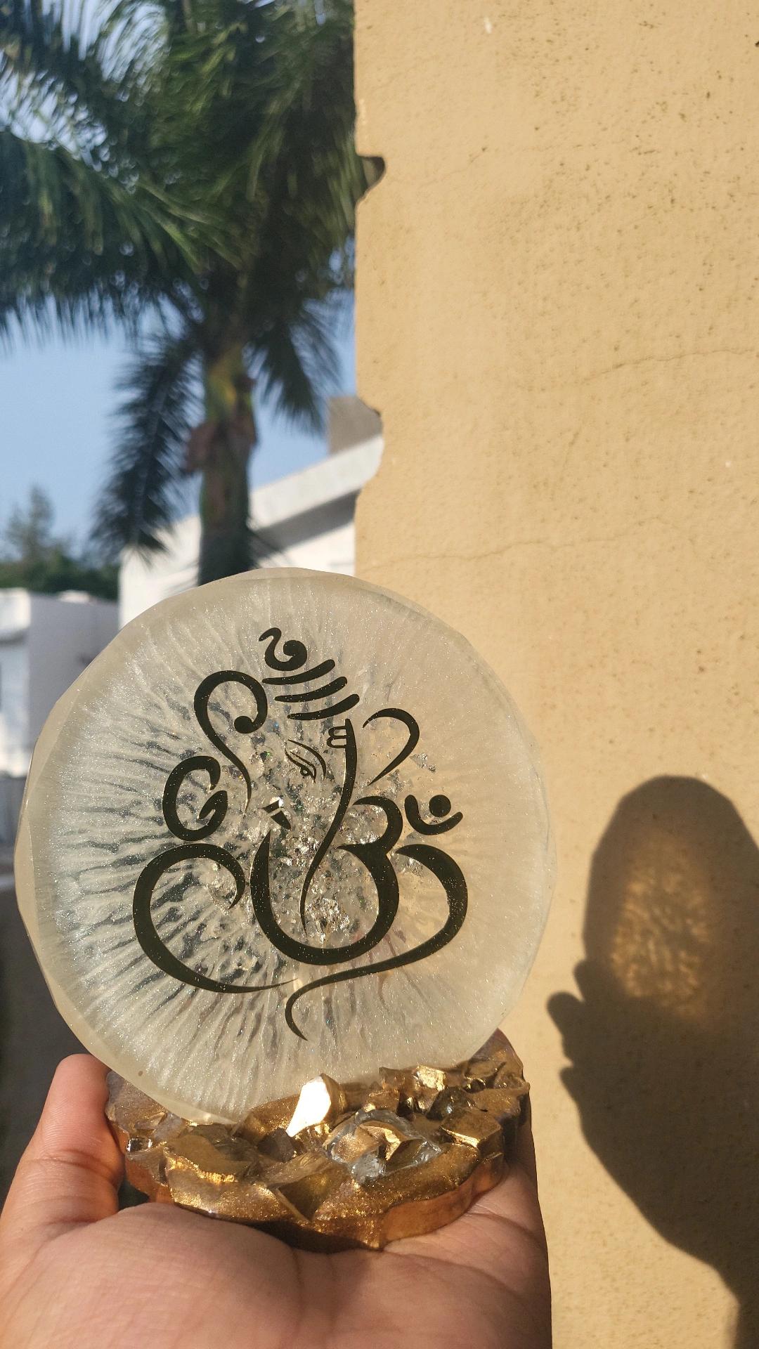 Ganesha Resin home decor piece held by a hand