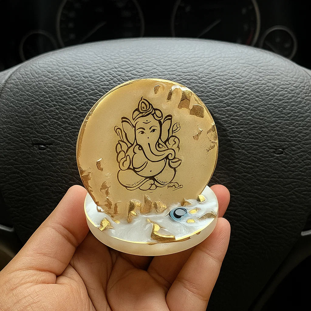 A ganesha stand held by a hand 