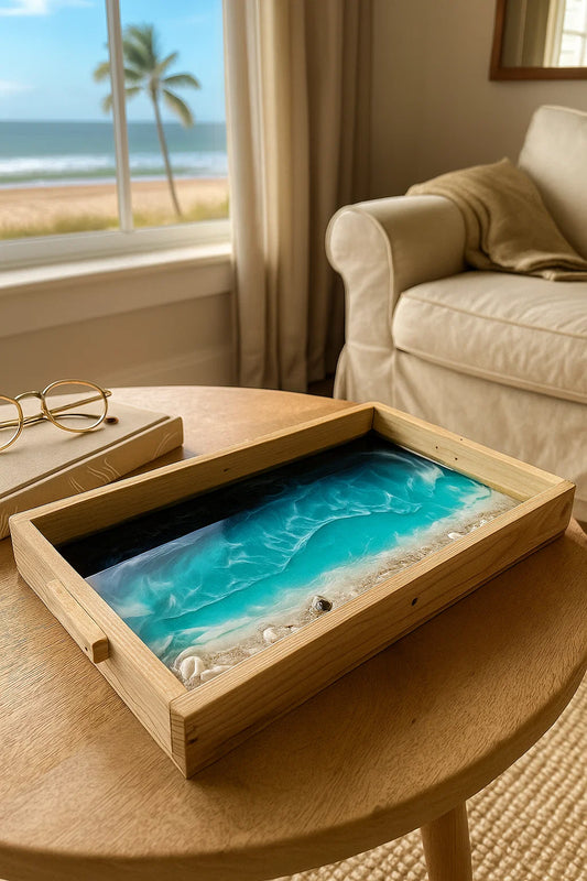 A wooden beach inspired resin art tray in a coastal side home ith a view of the sea
